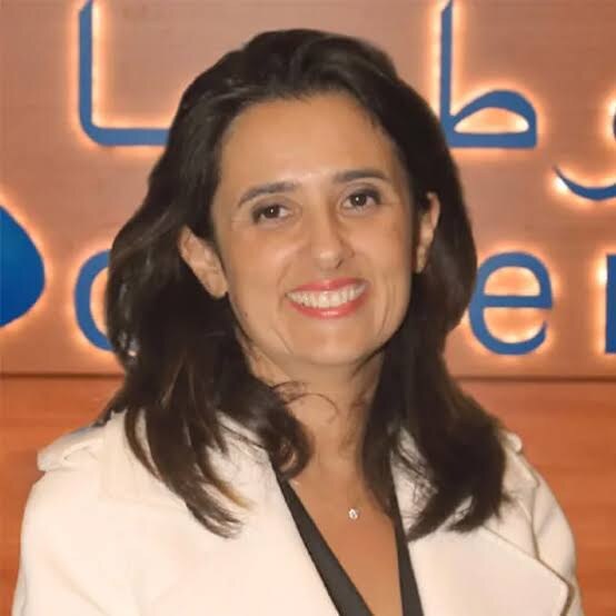 Lamia Tazi at a corporate event in front of the Sothema identity