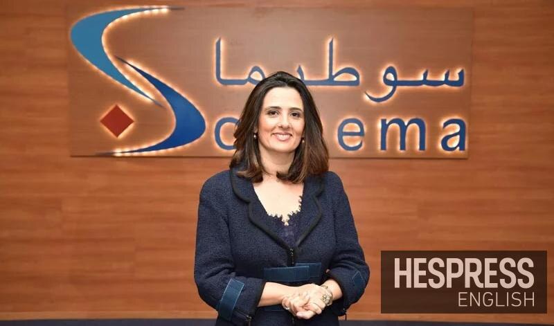 Lamia Tazi seated in front of the Sothema corporate identity during a broadcast interview